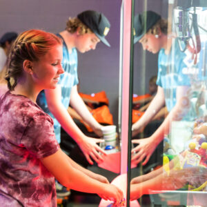 A girl plays a prize machine at the K1 Speed Arcade.