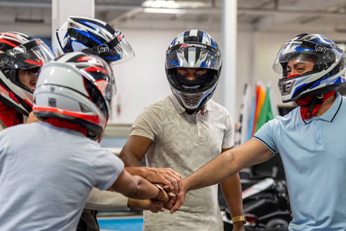 A group gets ready to race during a team building event at K1 Speed.