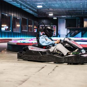 an adult racing a go-kart at k1 speed oxford