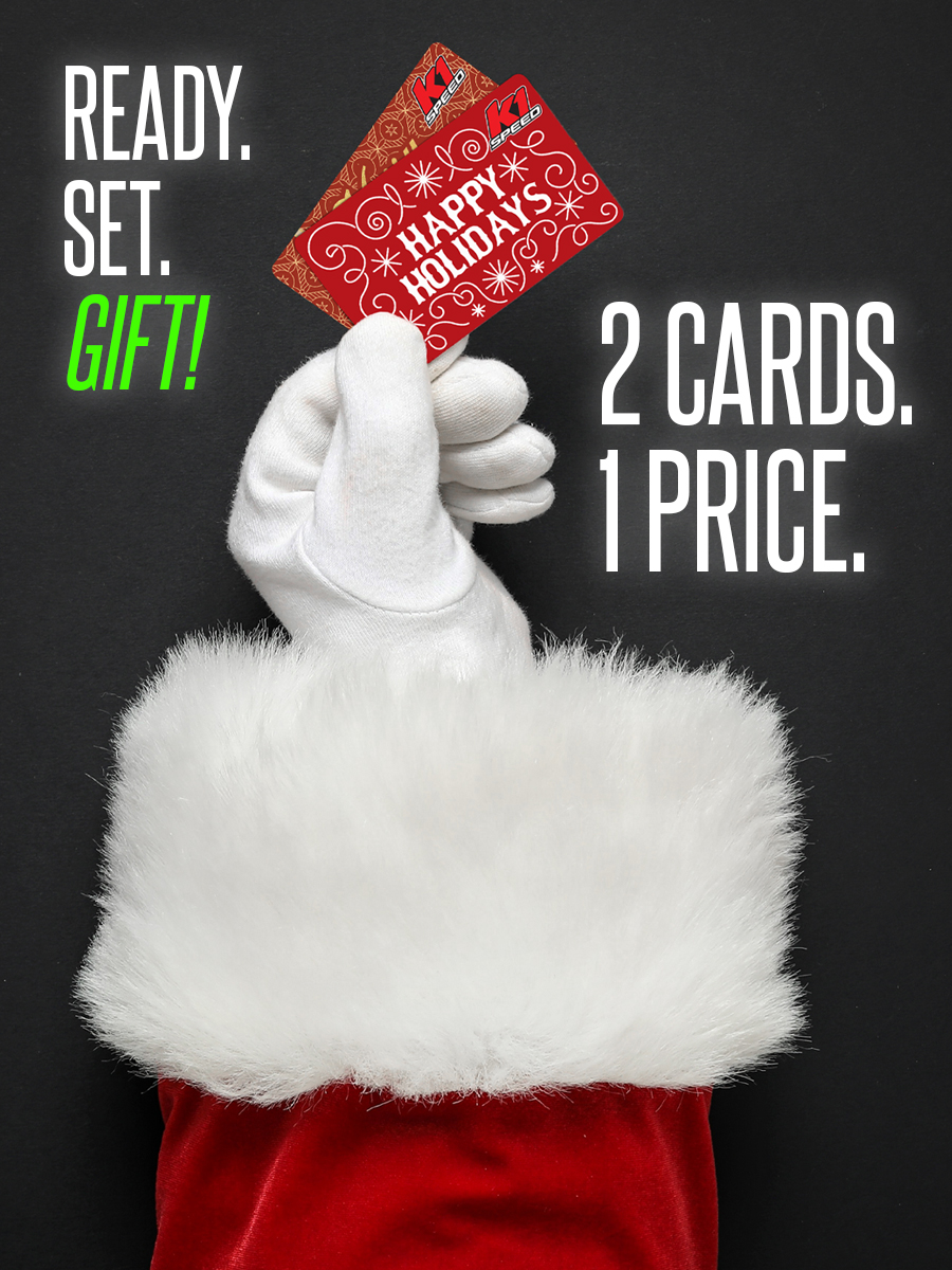 santa's gloved hand holding two gift cards with text reading "ready. set. gift" "2 cards. 1 price."