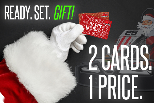 santa's gloved hand holding two gift cards with text reading "ready. set. gift" "2 cards. 1 price."