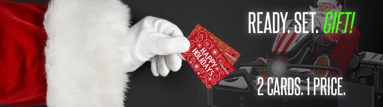 santa's gloved hand holding two gift cards with text reading "ready. set. gift" "2 cards. 1 price."