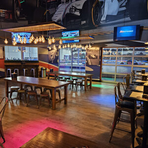 Seating at the Paddock Lounge, with a view of the track behind seating.