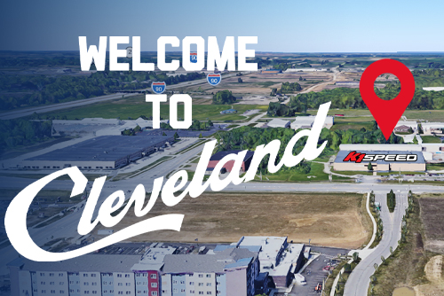 To K1 Speed's new location blog post, featuring an aerial view of the facility's location marked with a red map pin.