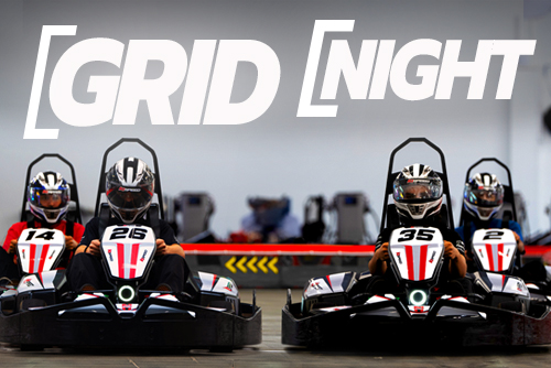Grid Night: Racers lined up on an indoor go-kart track.